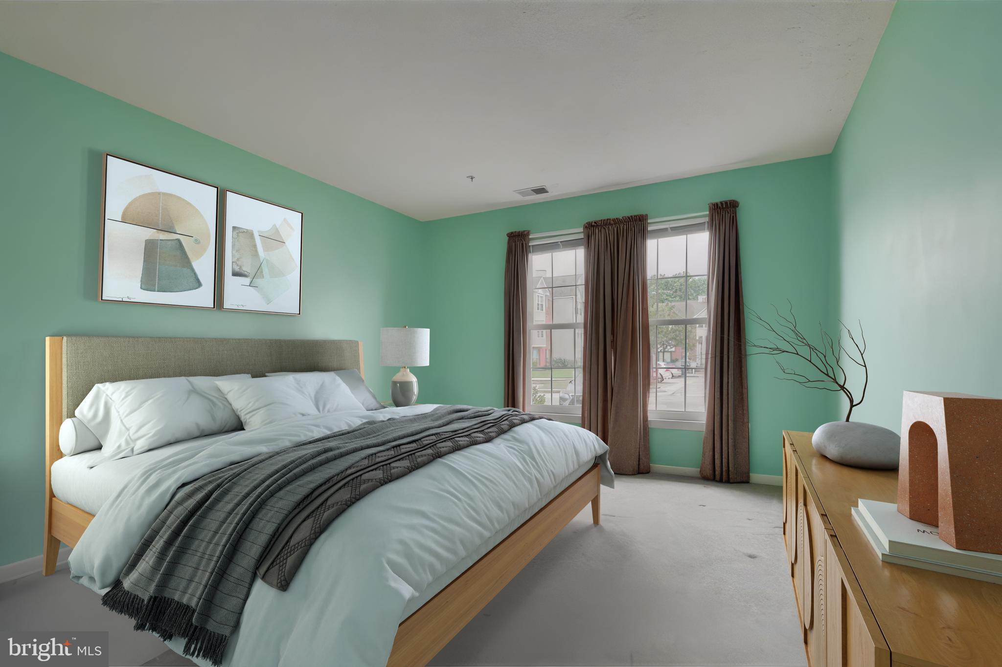 5318 Millfield Road, Unit 5318 Rosedale, MD 21237 - Photo 15 of 26 a bedroom with a bed and glass windows