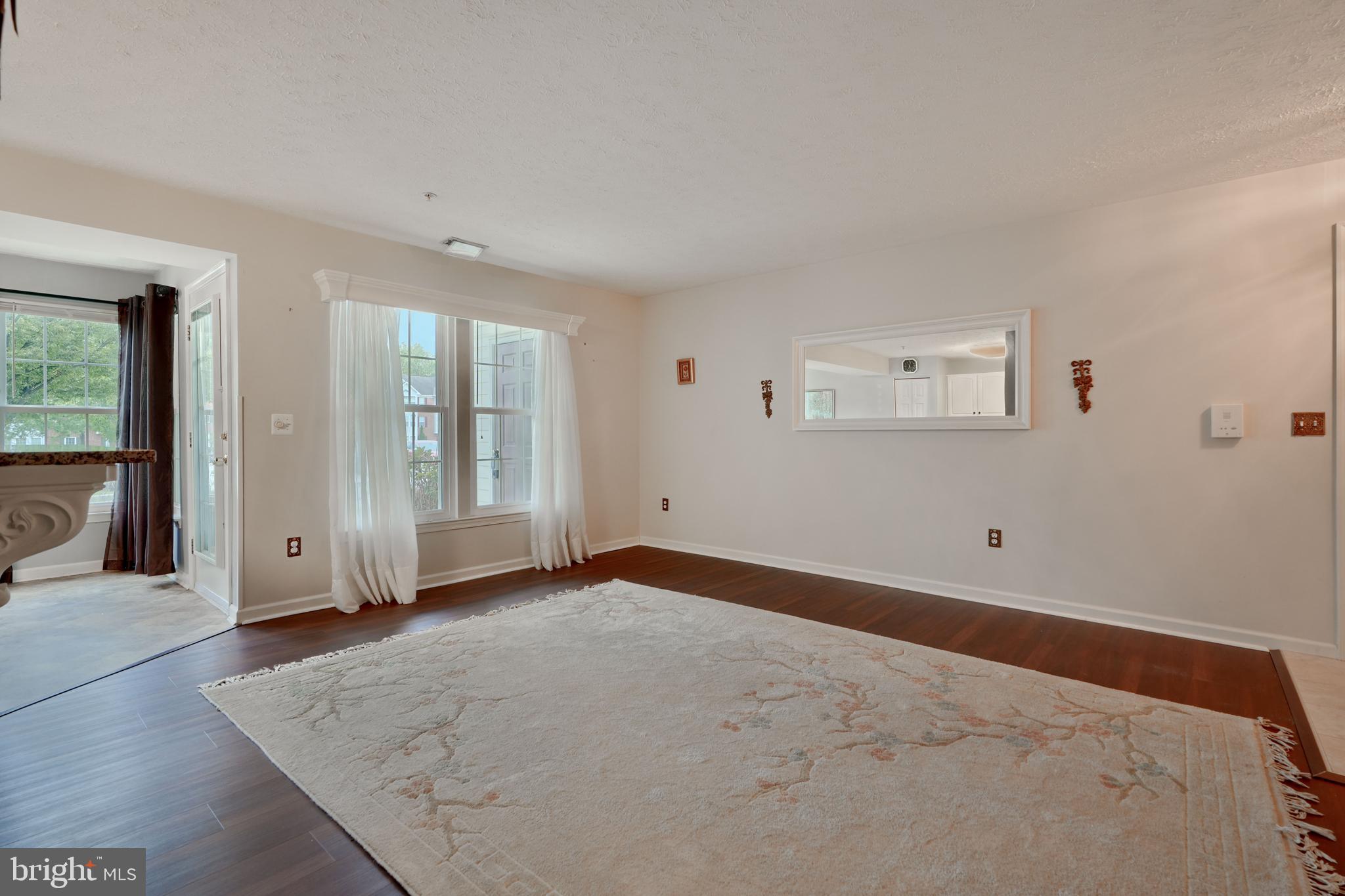 5318 Millfield Road, Unit 5318 Rosedale, MD 21237 - Photo 2 of 26 a view of an empty room with glass door