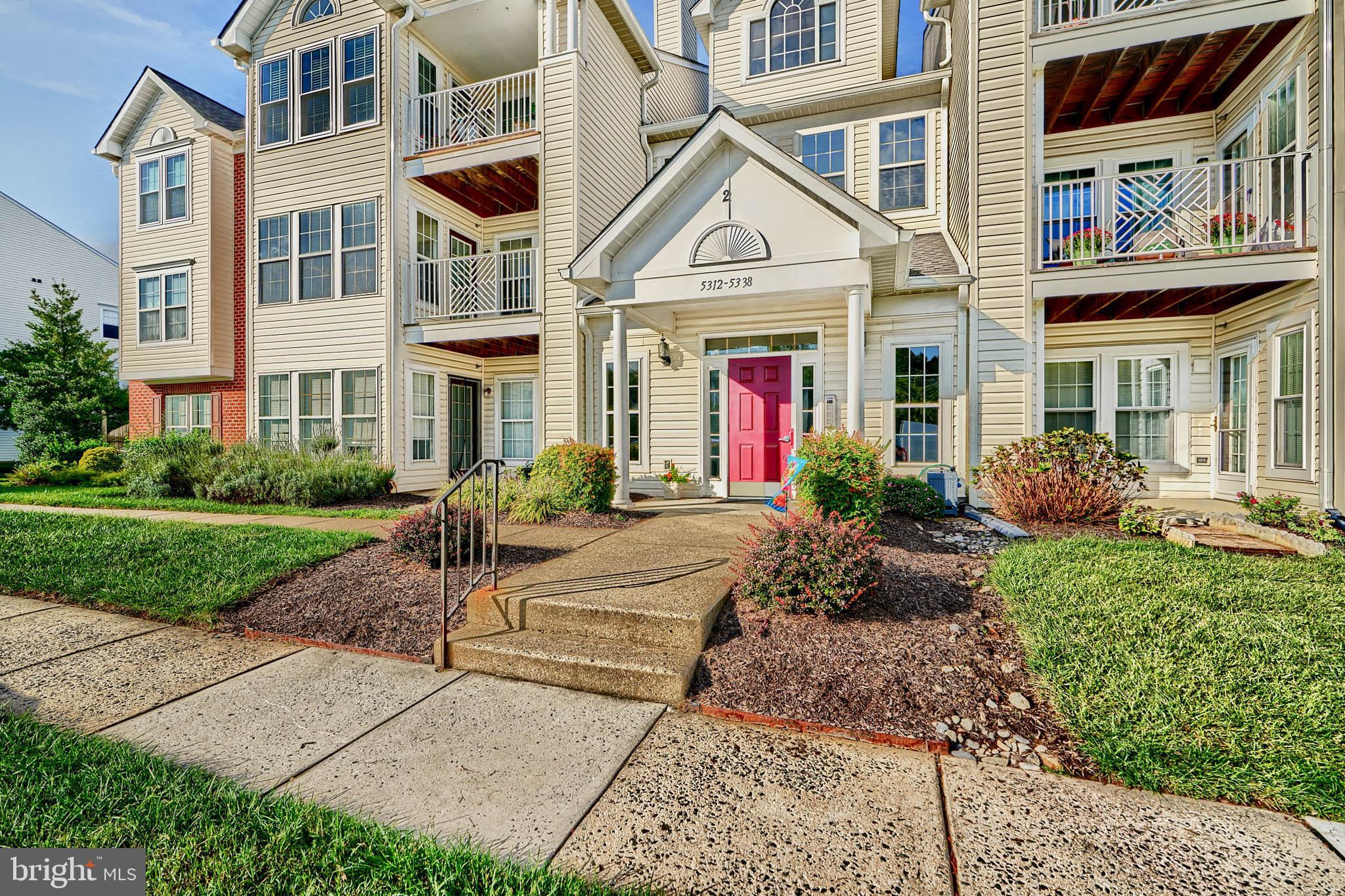 5318 Millfield Road, Unit 5318 Rosedale, MD 21237 - Photo 26 of 26 a front view of a house with garden and plants