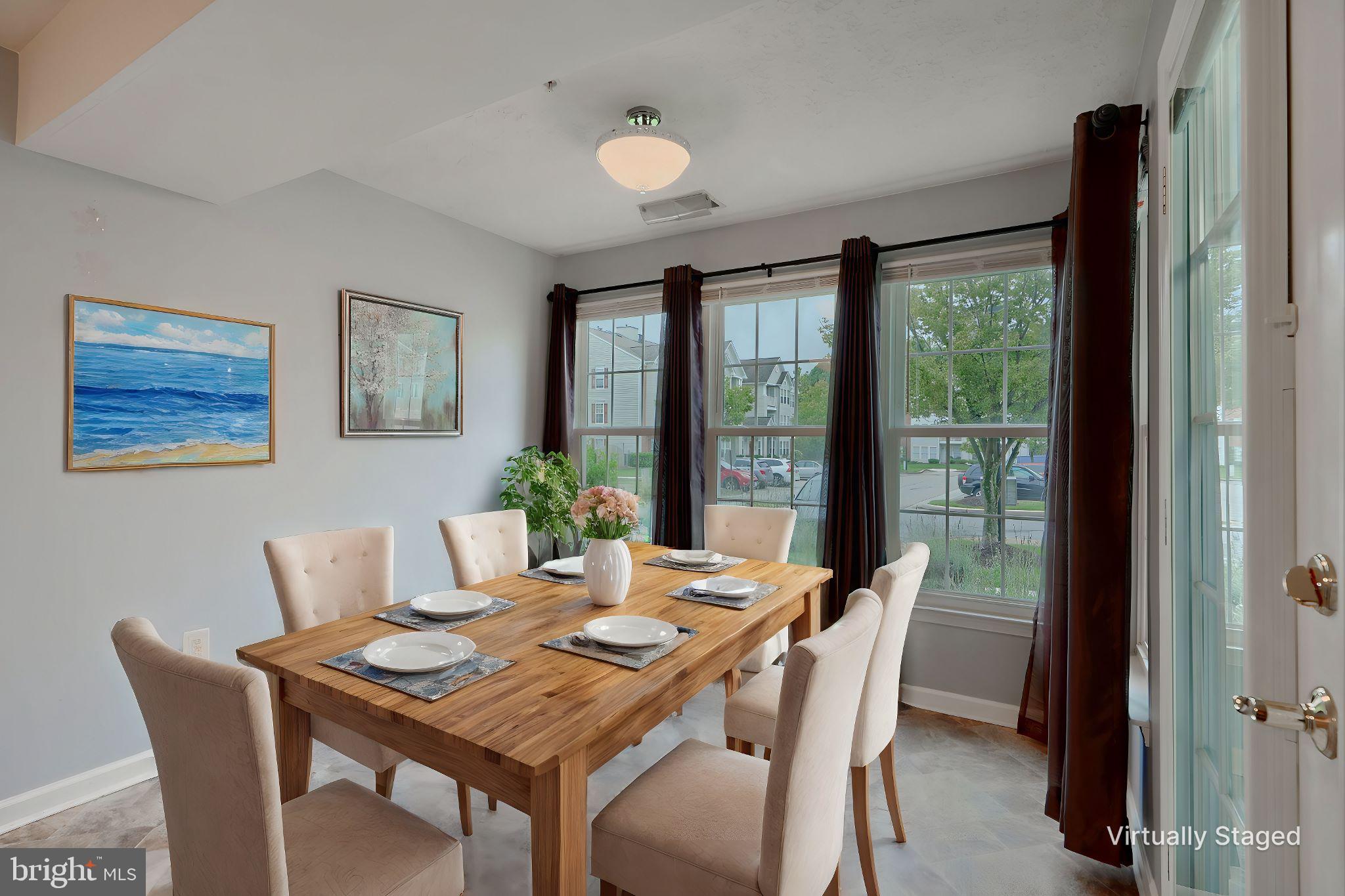 5318 Millfield Road, Unit 5318 Rosedale, MD 21237 - Photo 4 of 26 a view of a dining room with furniture window and outside view