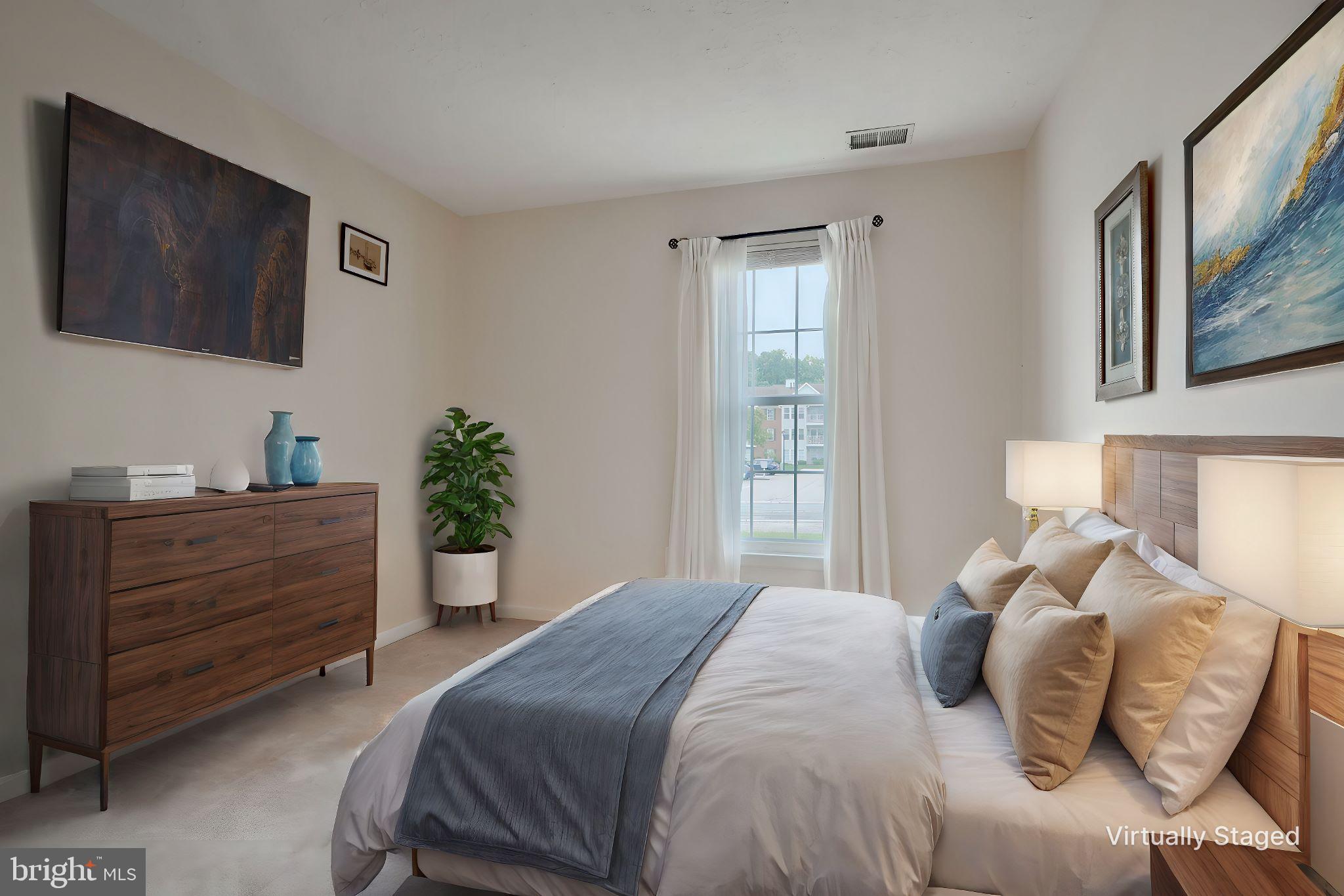 5318 Millfield Road, Unit 5318 Rosedale, MD 21237 - Photo 8 of 26 a bedroom with a bed potted plant and a window