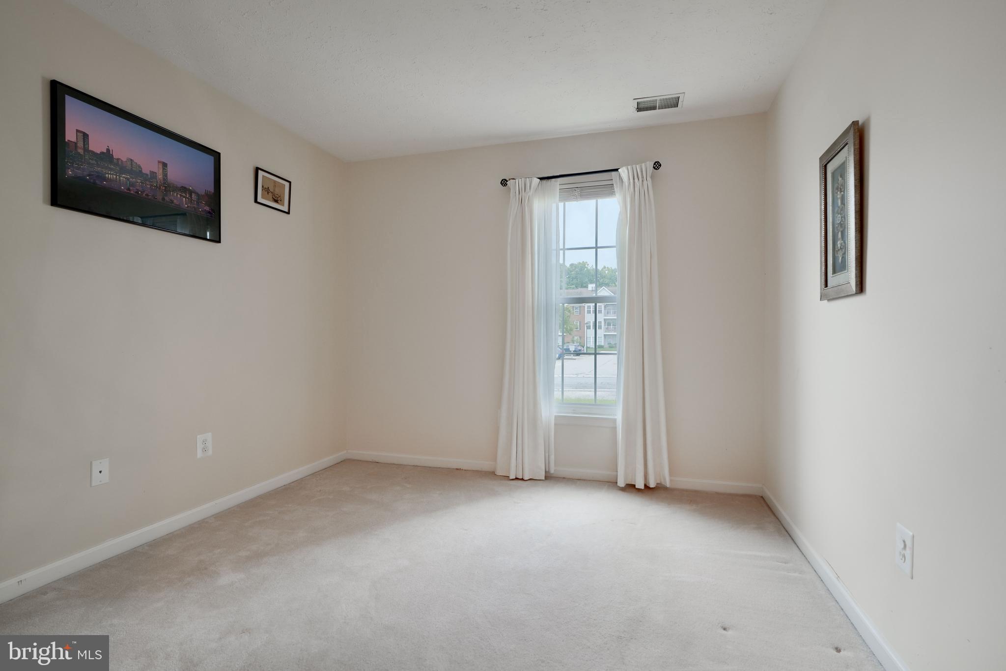 5318 Millfield Road, Unit 5318 Rosedale, MD 21237 - Photo 9 of 26 an empty room with windows and closet