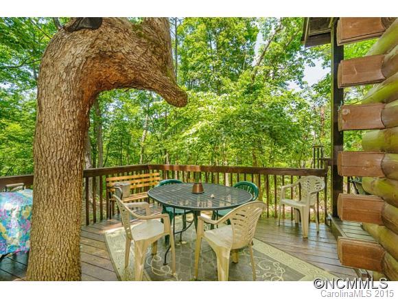 281 Tyler Terrace Rutherfordton, NC 28139 - Photo 12 of 18 a balcony with wooden floor table and chairs