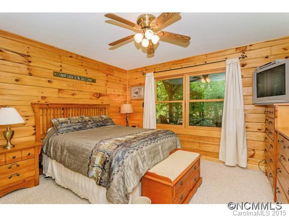281 Tyler Terrace Rutherfordton, NC 28139 - Photo 7 of 18 a bedroom with a large bed and a flat tv screen on dresser