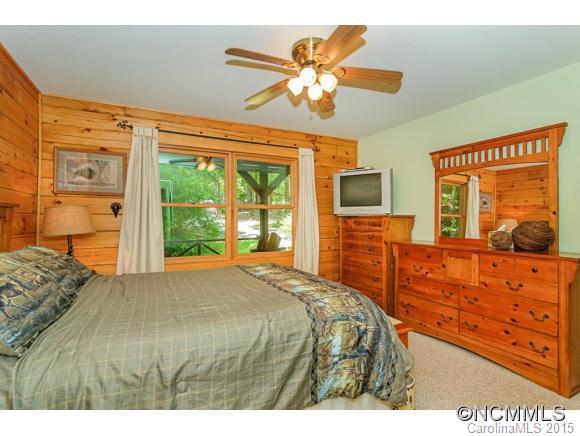 281 Tyler Terrace Rutherfordton, NC 28139 - Photo 8 of 18 a bedroom with a bed and a flat tv screen on dresser
