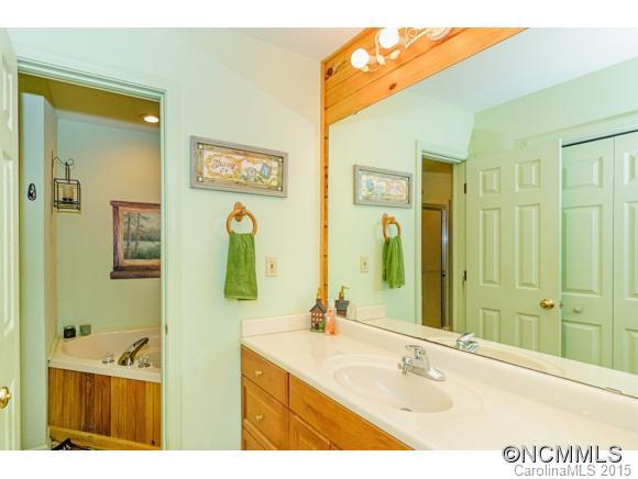 281 Tyler Terrace Rutherfordton, NC 28139 - Photo 9 of 18 a bathroom with a sink mirror and shower