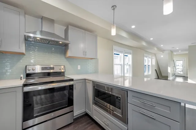 a kitchen with a stove and a sink