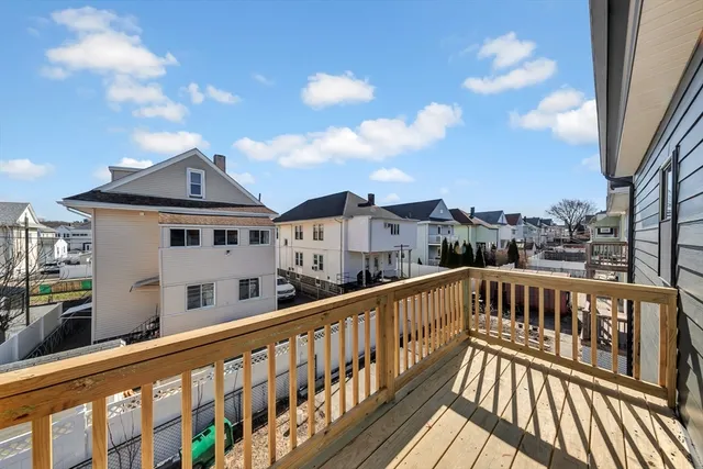 a view of a street with roof deck