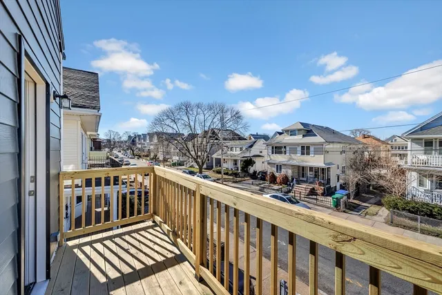 a bathroom with a sink mirror and toilet