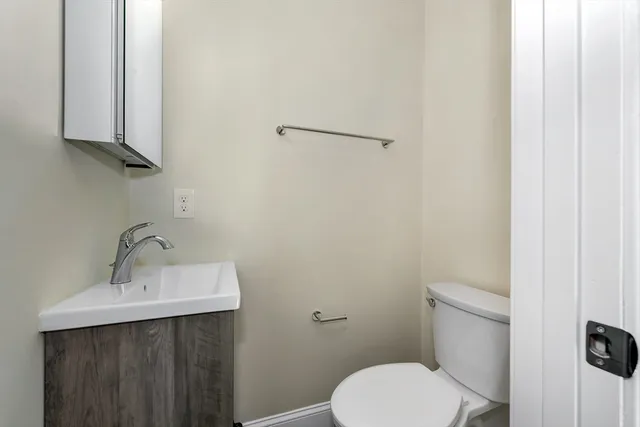 a bathroom with a sink shower and a mirror