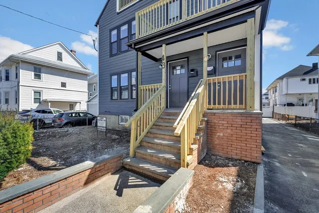 a view of a chair and tables in the patio