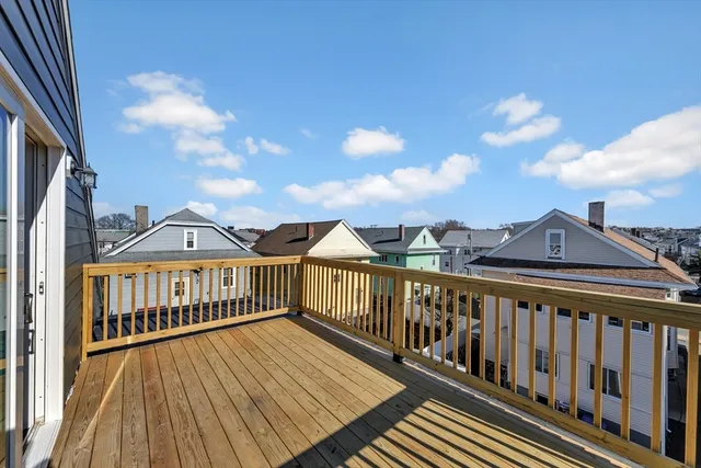 a view of a house with wooden deck