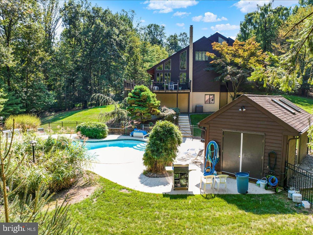 7 Hessian Boulevard Reading, PA 19607 - Photo 60 of 71 Serene retreat with pool and lush greenery.