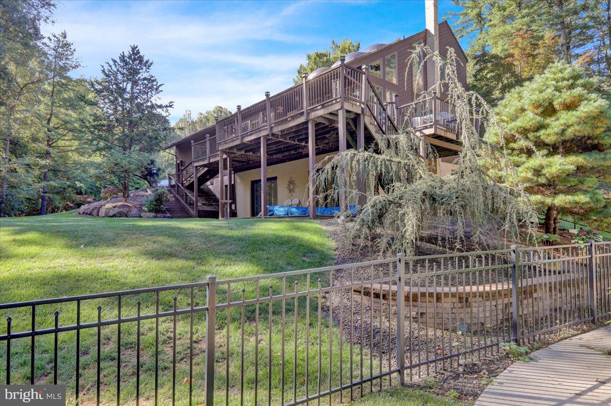 7 Hessian Boulevard Reading, PA 19607 - Photo 66 of 71 Serene retreat with lush greenery and deck.