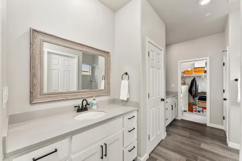 a bedroom with a bed and a flat tv screen