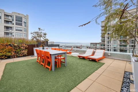 a view of a chairs and table in the patio