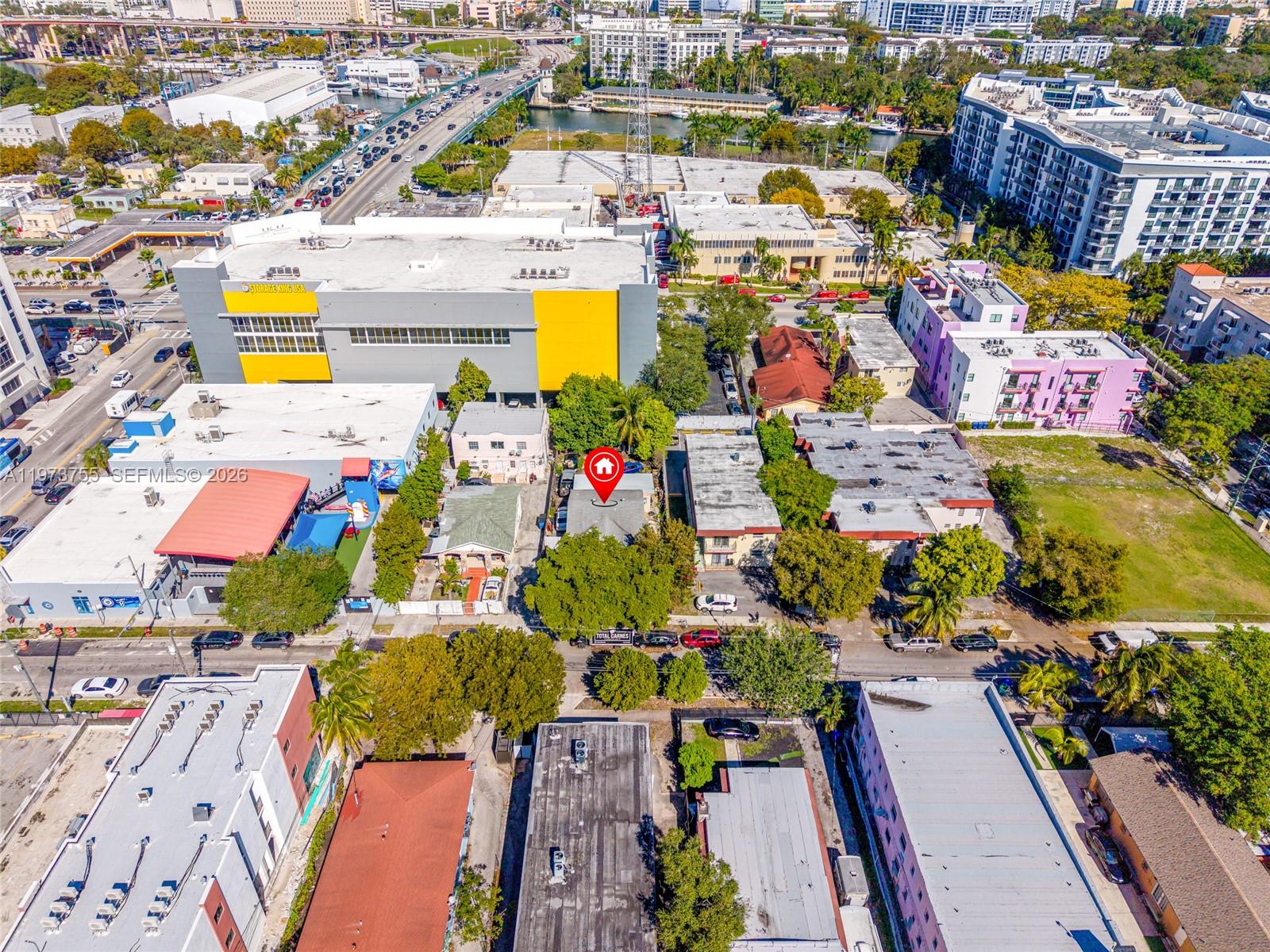 1143 Northwest 6 Street Miami, FL 33136 - Photo 18 of 18 an aerial view of residential houses with outdoor space and swimming pool