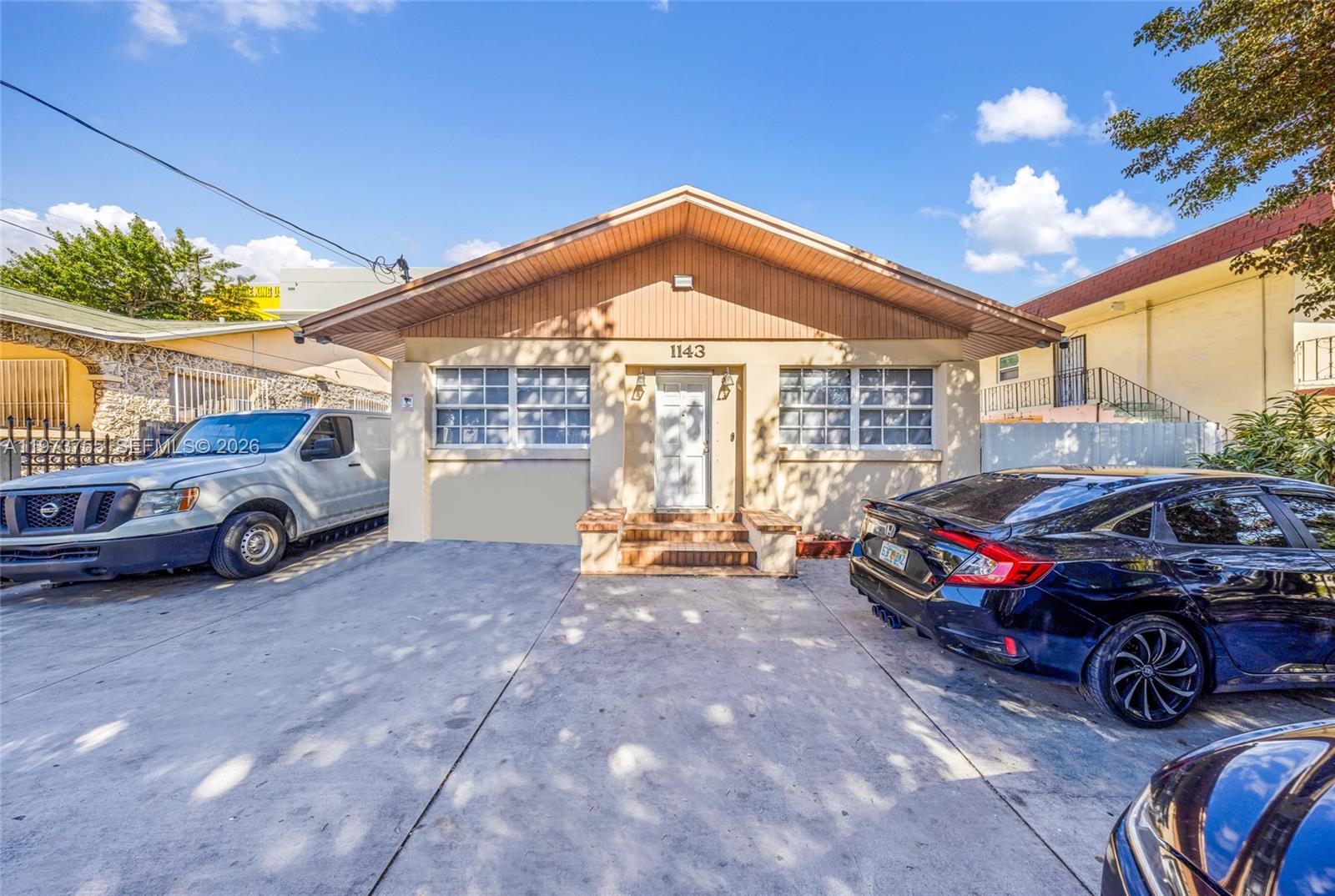 1143 Northwest 6 Street Miami, FL 33136 - Photo 3 of 18 a view of a car in garage