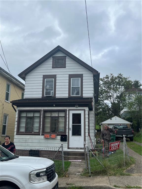 924 Locust Avenue Monessen, PA 15062 - Photo 1 of 25 a front view of a house with garden