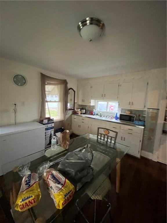 924 Locust Avenue Monessen, PA 15062 - Photo 7 of 25 a kitchen with a table chairs and a refrigerator