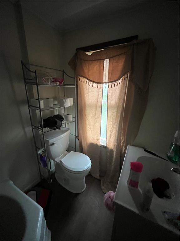924 Locust Avenue Monessen, PA 15062 - Photo 10 of 25 a bathroom with a toilet sink and mirror