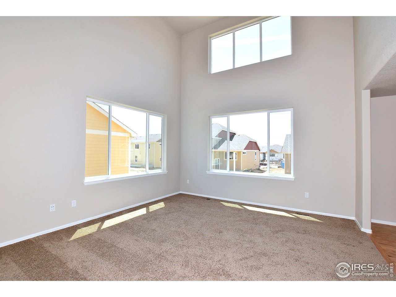312 August Lane Windsor, CO 80550 - Photo 11 of 40 an empty room with windows