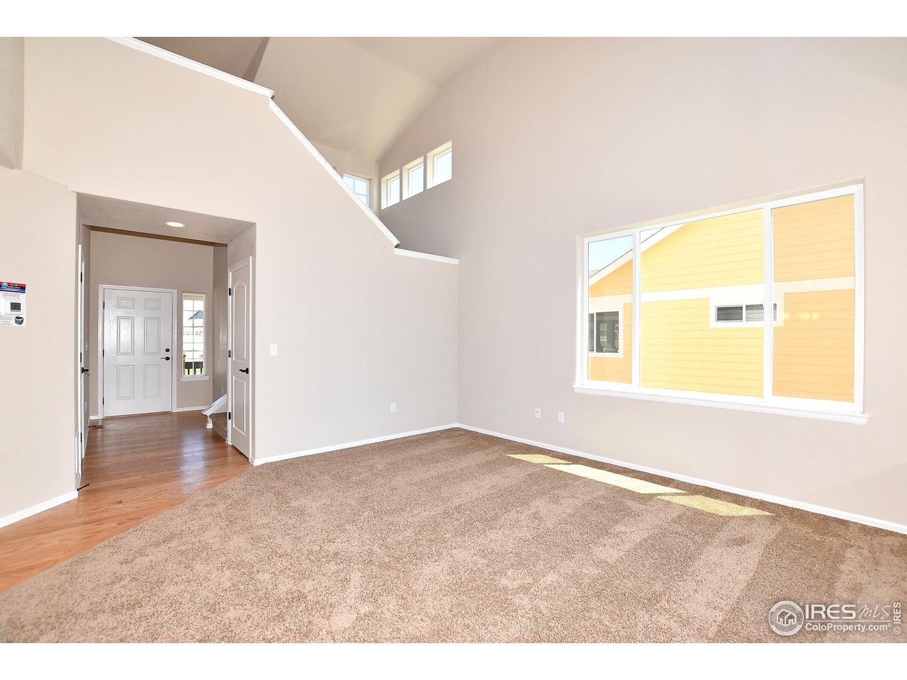 312 August Lane Windsor, CO 80550 - Photo 17 of 40 a view of an empty room and window