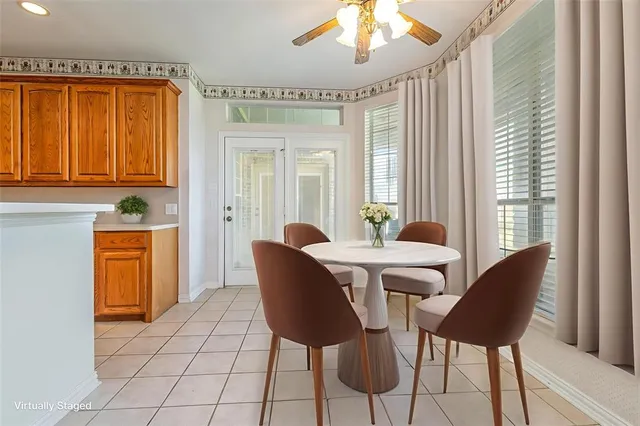 a view of a dining room with furniture and window