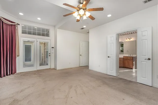a view of a livingroom with a chandelier fan
