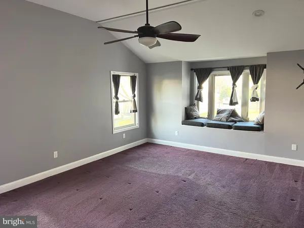 a view of a room with a large window