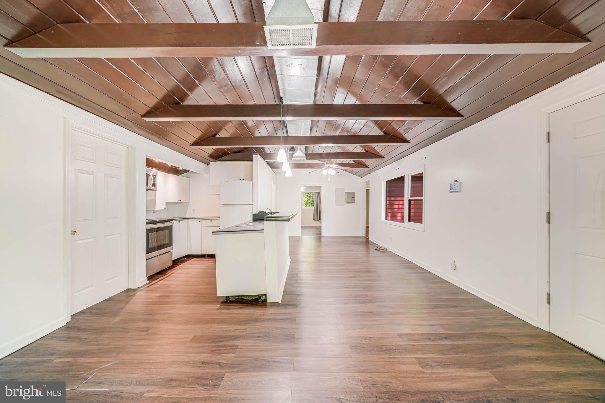 8304 Cobb Road Manassas, VA 20112 - Photo 6 of 35 Vaulted wood ceiling and exposed beams