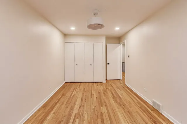 a view of hallway with wooden floor