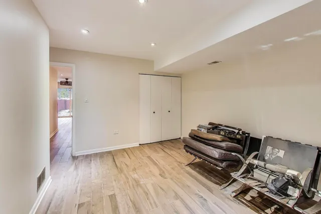 a view of room with wooden floor