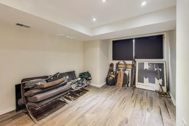 a view of a room with wooden floor