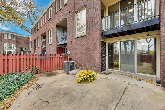 front view of a brick house with a large windows