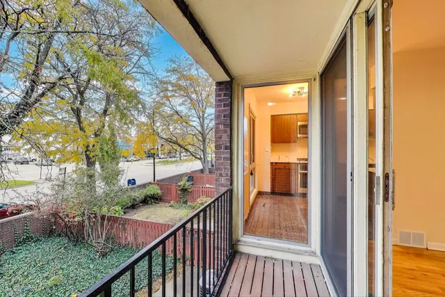 a view of a house with wooden deck