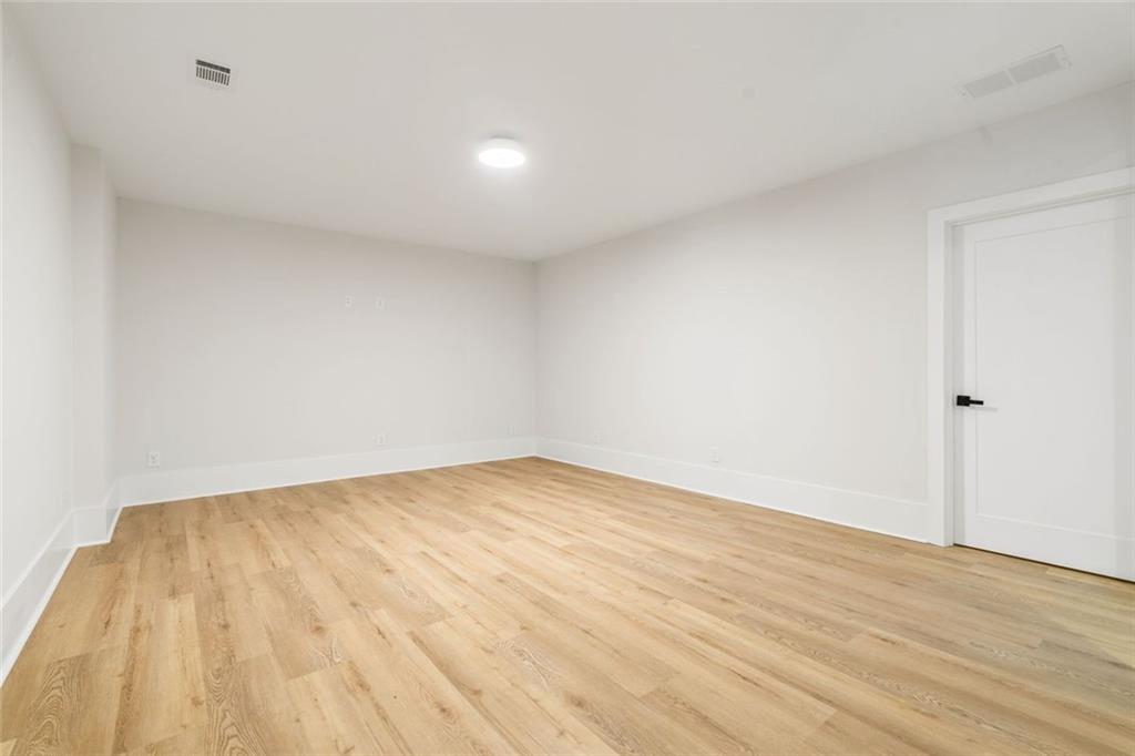 555 Lower Birmingham Road Canton, GA 30115 - Photo 91 of 104 a view of an empty room and wooden floor