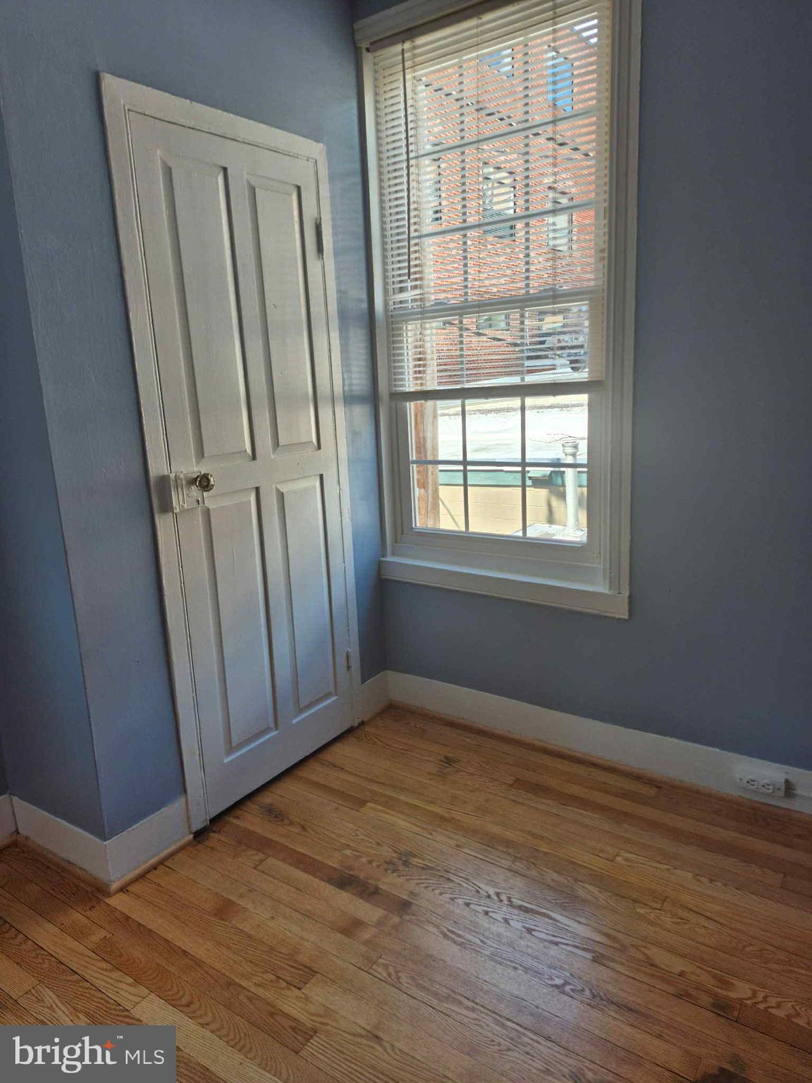 25 South Market Street, Unit 2 Frederick, MD 21701 - Photo 10 of 14 an empty room with wooden floor and windows