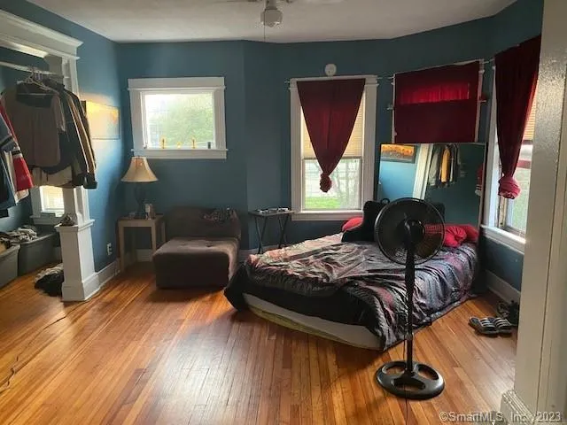 a view of a dining room with furniture window and wooden floor