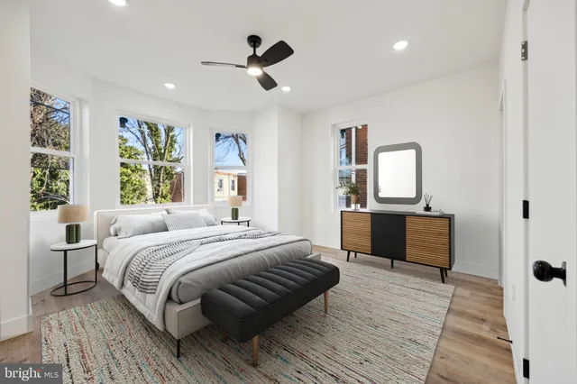 a bedroom with a large bed and a dresser