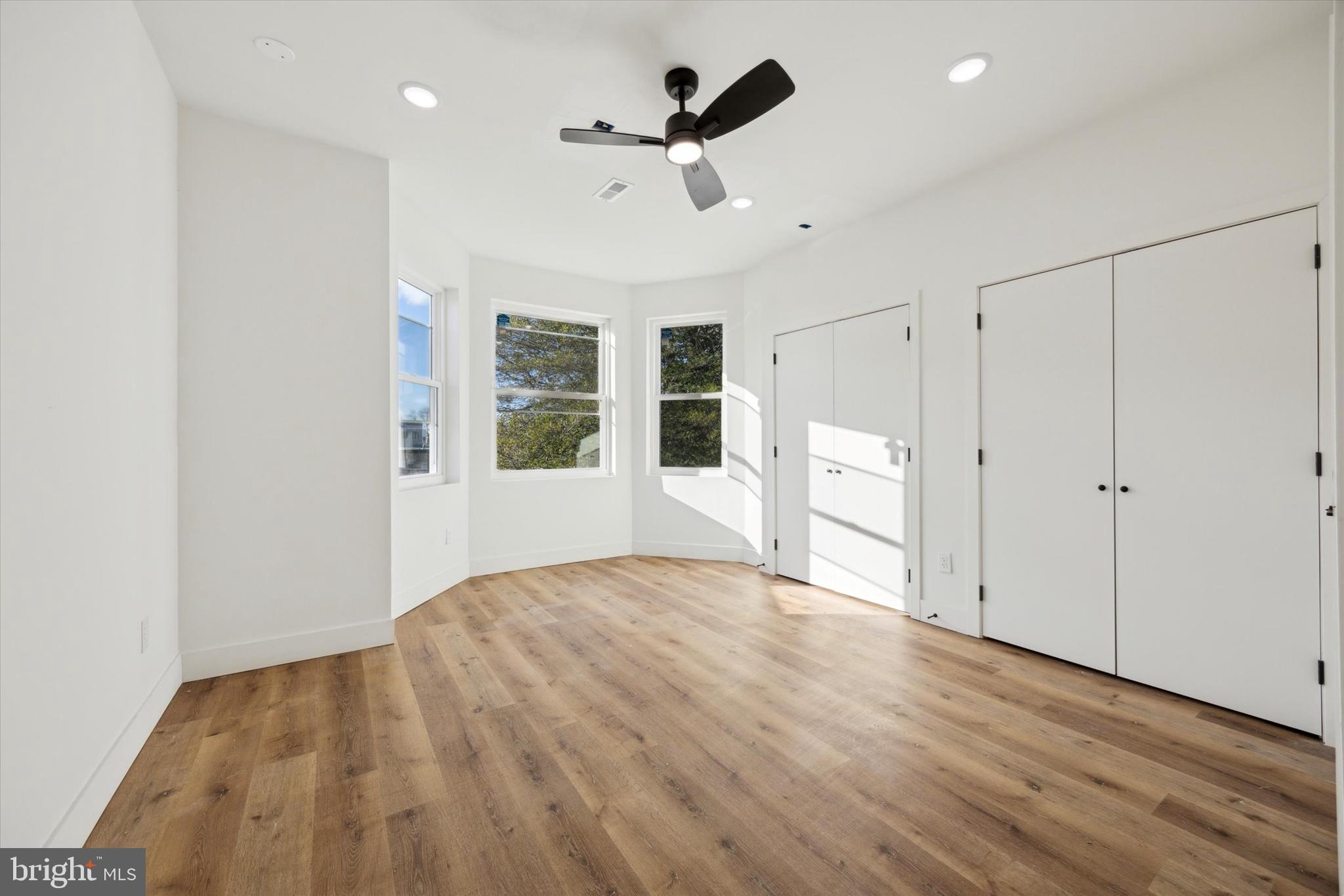 5325 Baltimore Avenue, Unit 2 Philadelphia, PA 19143 - Photo 19 of 25 a view of empty room with wooden floor and ceiling fan