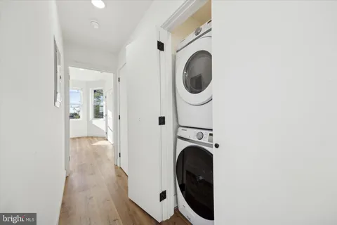 a view of a hallway with washer and dryer
