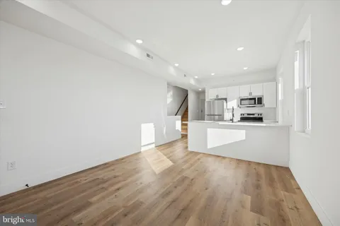 a view of kitchen with wooden floor