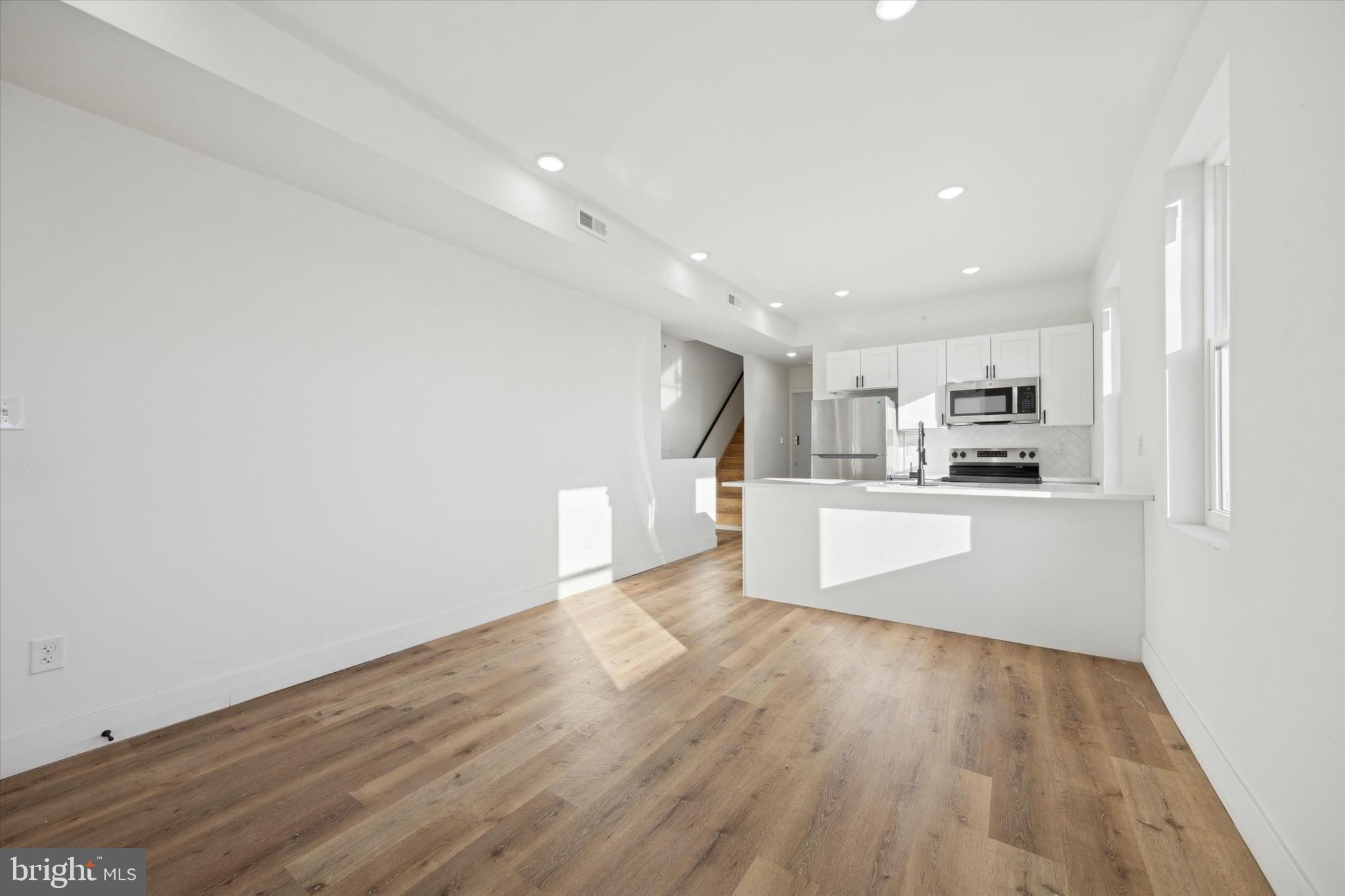 5325 Baltimore Avenue, Unit 2 Philadelphia, PA 19143 - Photo 5 of 25 a view of kitchen with wooden floor