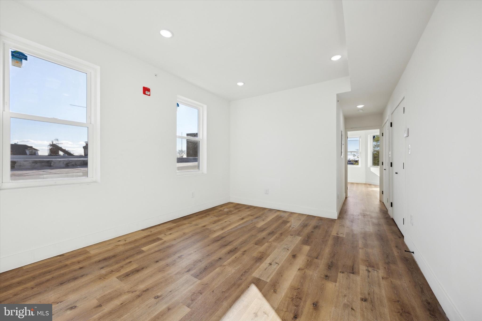 5325 Baltimore Avenue, Unit 2 Philadelphia, PA 19143 - Photo 6 of 25 a view of a big room with wooden floor and windows