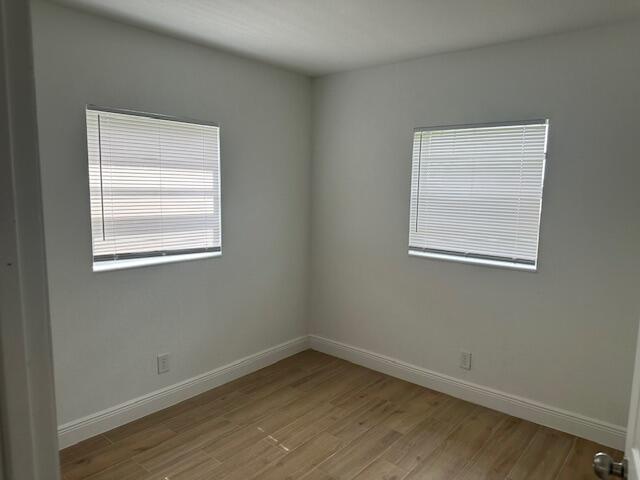491 West Jordan Boulevard Pahokee, FL 33476 - Photo 6 of 10 an empty room with a window