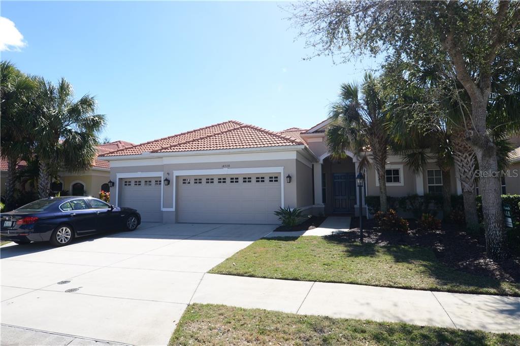 14508 Sundial Place Lakewood Ranch, FL 34202 - Photo 1 of 1 a front view of a house with a yard and garage