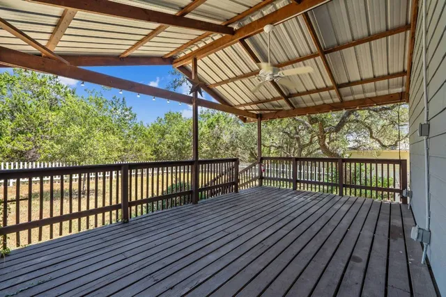 a view of a porch with wooden floor