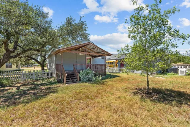 a view of balcony with wooden floor