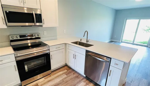a kitchen with a stove and a microwave